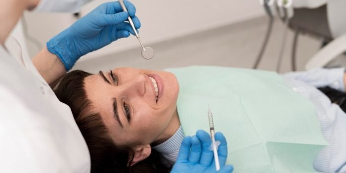 female-patient-having-procedure-done-dentist_23-2148985792